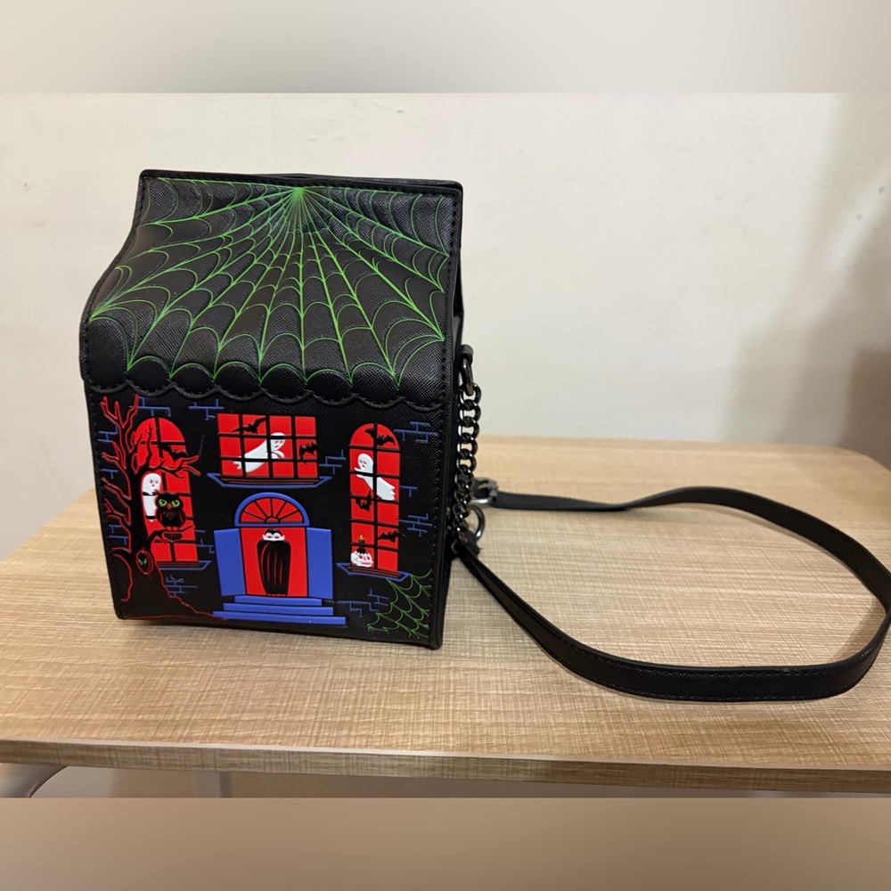 MAD Engine Black Haunted House Crossbody with Green Web and Red/Blue Accents